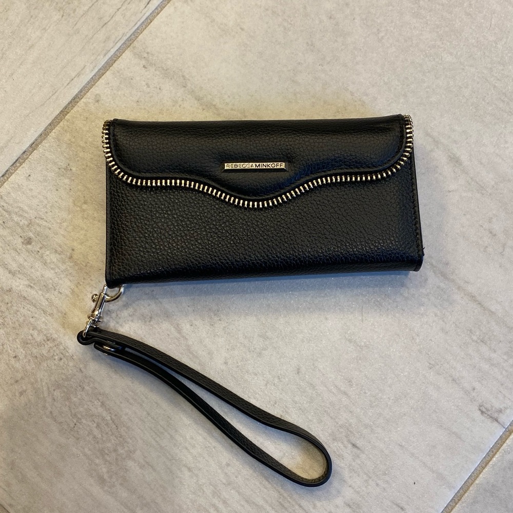 Rebecca Minkoff wristlet with phone charger.